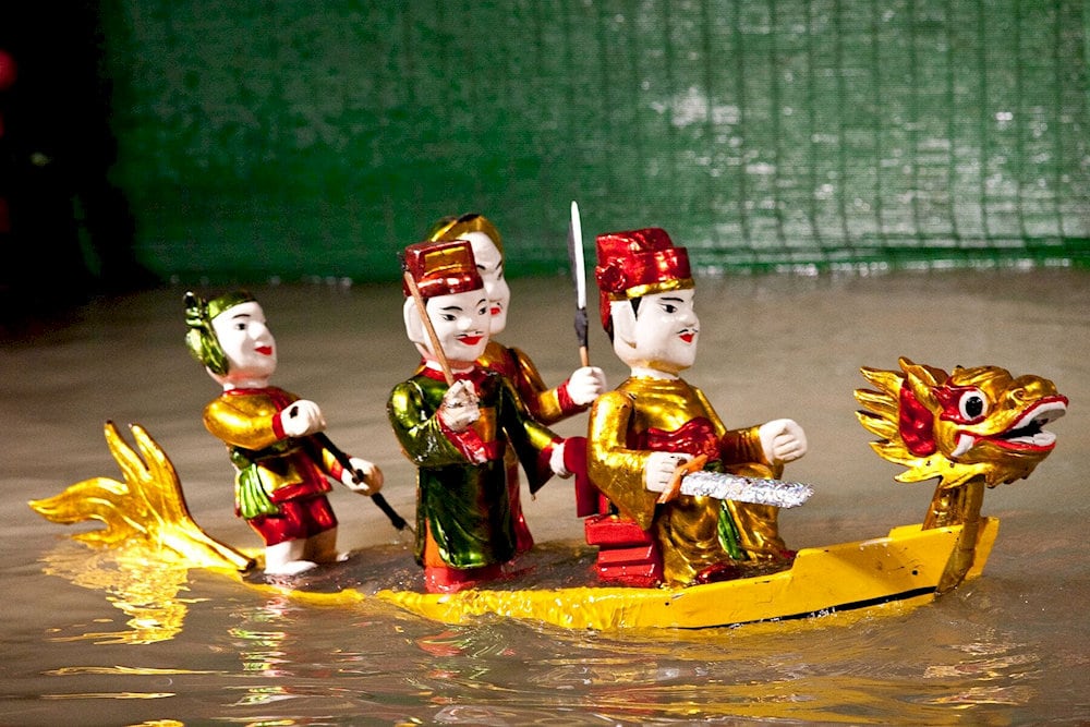 Attending a water puppet show in Hanoi is a unique and unforgettable experience